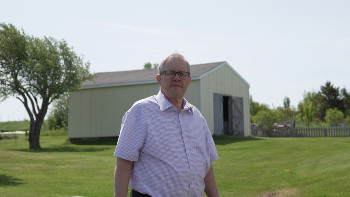 MacAulay standing in his yard